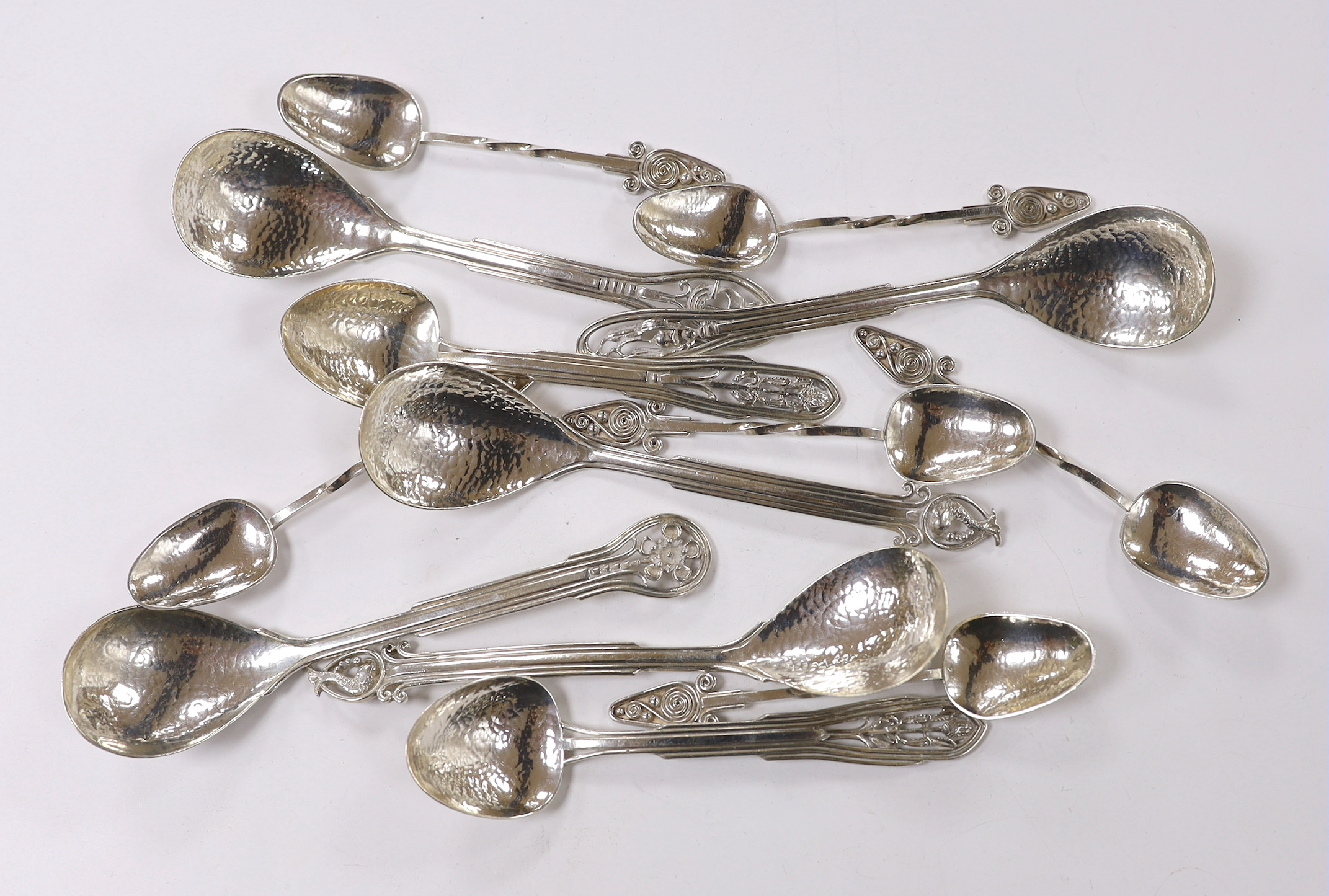 Seven Australian Arts & Crafts sterling spoons, by James A. Linton, with planished bowls and differing terminals, largest 15.2cm, together with a set of six Australian Arts & Crafts sterling small spoons, one with maker'